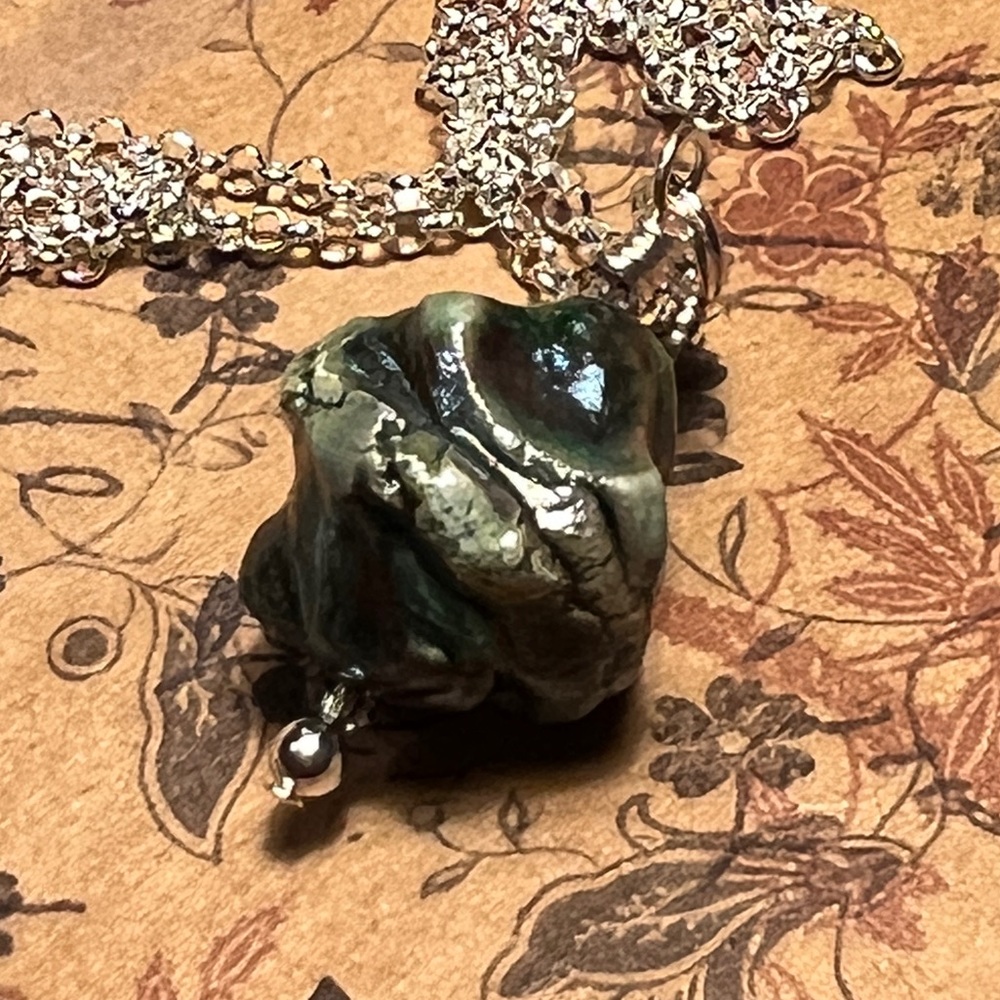 Outdoor kiln pottery pendant: Raku’. Collection: Artisan handmade Raku’ bead.